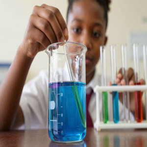 KWS student performing Titration in Chemistry Lab